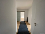 Flur - Erstbezug, moderne 3 Zimmer Neubauwohnung in beliebter Wohnlage von Bad Zwischenahn