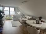 Wohnzimmer - Wohnen in Bad Zwischenahn: Großzügige 3-Zimmerwohnung mit Balkon und PKW Stellplatz